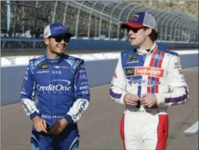  ?? THE ASSOCIATED PRESS FILE PHOTO ?? Kyle Larson and Ryan Blaney talk before qualifying for Sunday’s race in Avondale, Ariz.
