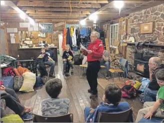  ?? SUBMITTED ?? The First Wolfville Cubs and their leaders enjoying an evening of storytelli­ng by Scouter Ian Macdonald in the main common area of the E. Percy Brown Lodge.
