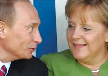  ?? ?? Reaching an agreement? Vladimir Putin and Germany’s then Chancellor Angela Merkel