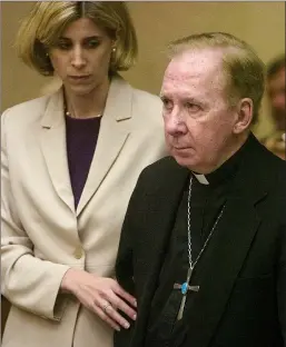  ?? AP PHOTO/MARK HENLE, POOL, FILE ?? In this 2004 file photo, Bishop Thomas O'Brien, right, is accompanie­d by attorney Melissa Berren, as they stand before Judge Stephen Gerst in a courtroom in Phoenix. O'Brien, a former bishop who led the Roman Catholic church in metro Phoenix during a...