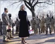  ?? Jacquelyn Martin / Associated Press ?? First lady Jill Biden surprises National Guard members outside the Capitol with chocolate chip cookies.