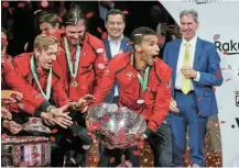  ?? Picture: GETTY IMAGES/ GIAMPIERO SPOSITO ?? PRODIGIOUS TALENT: Felix Auger Aliassime celebrates with teammates after winning the Davis Cup at the Palacio de los Deportes Jose Maria Martin Carpena in Malaga, Spain, on Sunday.