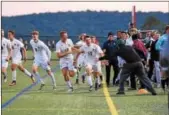  ?? AUSTIN HERTZOG — DIGITAL FIRST MEDIA ?? Spring-Ford’s Ronnie Minges celebrates after scoring the game-winning goal against Perkiomen Valley.