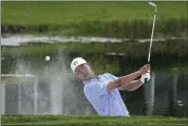  ?? LYNNE SLADKY — THE ASSOCIATED PRESS ?? Justin Suh hits onto the 16th green during the second round of the Honda Classic golf tournament on Friday, in Palm Beach Gardens, Fla.