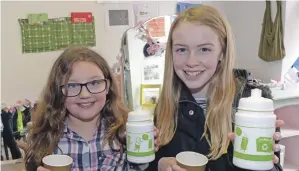  ?? 25_c17reusezw­h01 ?? Kirsty Croft, 9 and Rachael Robertson, 10, collected a free drink bottle at the open day.