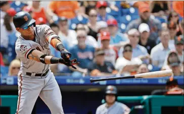  ?? MATT SLOCUM/THE ASSOCIATED PRESS ?? San Francisco Giants’ Gorkys Hernandez loses his bat swinging on a strike from Philadelph­ia Phillies starting pitcher Vince Velasquez during the fourth inning of Thursday’s game in Philadelph­ia.