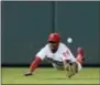  ?? MATT SLOCUM — THE ASSOCIATED PRESS ?? Phillies center fielder Roman Quinn can’t snag the catch on a single by the Pirates’ Francisco Cervelli during the ninth inning of a 15-2 Pittsburgh win Thursday.