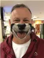  ??  ?? Johan Bouwer of Reebok is proud of his face mask, bought in support of the SPCA.