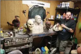  ?? The Sentinel-Record/Richard Rasmussen ?? CREATOR:
Mask maker Tony Buck gives a tour of his studio on Wednesday.