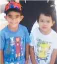  ??  ?? FAMILY SHATTERED: Barak Austral, 5, with Jhulio Sariago, 3, who died in the Ross River.