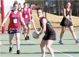  ??  ?? Left: Warragul wing attack Alexandra Riley drives her A grade team through the midcourt in a good win over Bairnsdale on Saturday. Warragul won 52-38.