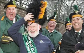  ??  ?? Grand Marshal Brian McMahon with members of the FCA Band.