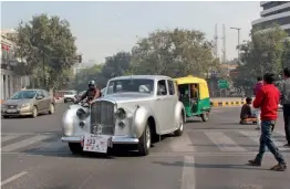  ?? — BIPLAB BANERJEE, PTI ?? Participan­ts at the 52nd edition of ‘ The Statesman Vintage and Classic Car Rally’ in New Delhi on Sunday. As many as 230 cars were showcased at the rally, and many rare cars from 1903 to 1980 were also seen at the venue.