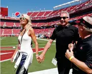  ?? AP FILE PHOTO ?? In this Sept. 16, 2018, file photo, Joe Montana and his wife, left, Jennifer walk onto the field at Levi's Stadium before an NFL football.