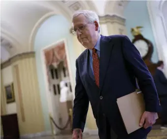  ?? Ap pHotos ?? DENIED: Senate Minority Leader Mitch McConnell, R-Ky., walks to the chamber for a test vote on a government spending bill, at the Capitol in Washington, Monday.