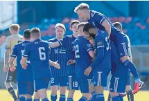  ??  ?? Peterhead players celebrate Scott Brown’s leveller against Forfar Athletic. Picture by Scott Baxter.