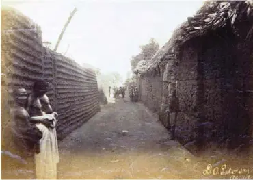  ??  ?? View along a street in the royal quarter of Benin City, 1897. Photograph: The British Museum/Trustees of the British Museum