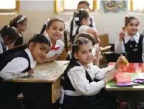  ?? — AFP ?? Schoolgirl­s sit in a class before receiving a measles vaccine at a school in Baghdad on April 14, 2024, part of a vaccinatio­n campaign for school students across Iraq.