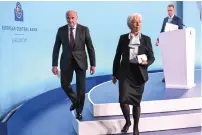  ?? — AFP ?? ECB president Christine Lagarde leaves after addressing a press conference following the meeting of the governing council in Frankfurt on Thursday.