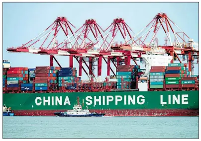  ?? AP ?? A container ship sits docked this spring in Qingdao, China. The rhetoric between the U.S. and China over trade tariffs is intensifyi­ng.