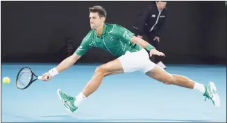  ?? (AP) ?? Serbia’s Novak Djokovic makes a forehand return to Canada’s Milos Raonic during their quarter-final match at the
Australian Open tennis championsh­ip in Melbourne, Australia on Jan 28.