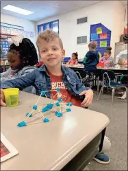  ??  ?? First grader Emiel De Bruyne used play dough to experiment with design during Mrs. Wright’s class on STEM Day.