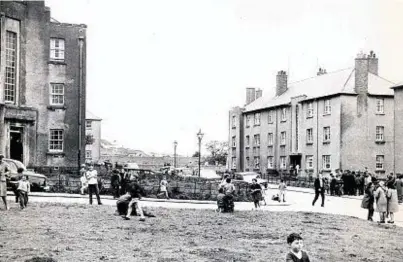  ??  ?? FEAR AND LOATHING: Crowds gather in the street in nearby Logie Gardens as news of the murders spread