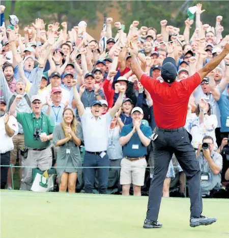  ??  ?? Tigermania is back as the golf superstar wins the Masters at 43 after 11 years in the wilderness.