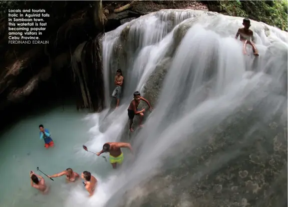  ?? FERDINAND EDRALIN ?? Locals and tourists frolic in Aguinid falls in Samboan town. This waterfall is fast becoming popular among visitors in Cebu Province.