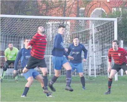  ??  ?? ●●Action from Mellor’s game against Whalley Range (in red and black)