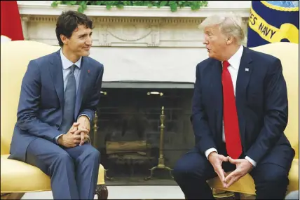  ?? AP PHOTO ?? A Canada-u.s. women-in-business group created by Prime Minister Justin Trudeau (left) and U.S. President Donald Trump released its first set of recommenda­tions Wednesday, proposing more affordable child care and a new binational procuremen­t initiative.