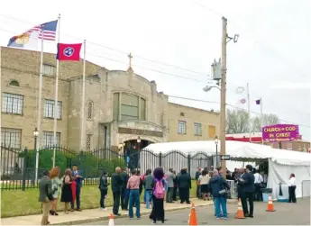  ?? DOMETI PONGO/ WGN RADIO ?? People wait outside Mason Temple in Memphis for Tuesday’s event. Mason Temple is the site where Dr. Martin Luther King Jr. gave the “Mountainto­p” speech 50 years ago.