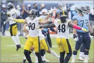  ?? MARK ZALESKI — THE ASSOCIATED PRESS ?? Steelers outside linebacker­s T. J. Watt and Bud Dupree celebrate after a 45- yard field goal attempt by Titans kicker Stephen Gostkowski was no good in the final seconds of the fourth quarter Sunday in Nashville, Tenn. The Steelers won 27- 24.