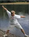  ??  ?? Russ Byars skips a stone at the Riverfront Park in Franklin, Venango County.