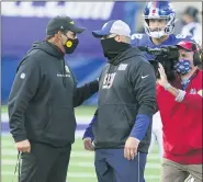  ?? JOHN MINCHILLO — THE ASSOCIATED PRESS ?? Washington Football Team’s Ron Rivera, left, talks to New York Giants’ Joe Judge, right, after an NFL football game Sunday.