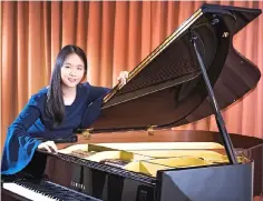  ??  ?? Nien Chin with her piano.