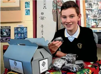  ?? PHOTO: WARWICK SMITH/FAIRFAX NZ ?? Awatapu College 14-year-old Josh Rackard has been baking his way to Japan, with his business Black Market Brownies.