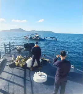  ?? PHOTOGRAPH COURTESY OF PCG ?? COAST Guard operatives based in Masbate conduct a joint patrol operation with the Department of Agricultur­e- Bureau of Fisheries and Aquatic Resources in the waters off Masbate. The Coast Guard ensures the security of the country’s coasts while BFAR guards against destructiv­e fishing activities.