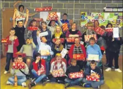  ??  ?? Members of Silver Cross Youth Club and helpers packed shoe boxes for the Samaritans Purse appeal