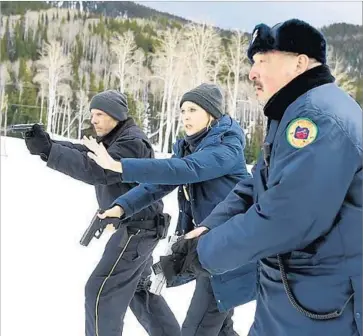  ?? Fred Hayes Weinstein Co. ?? HUGH DILLON, left, Elizabeth Olsen and Graham Greene are on the hunt for a killer in “Wind River.”