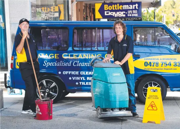  ?? Picture: STEWART McLEAN ?? IMPROVISIN­G: Image Cleaning Corp owner John Mason and employee Luke Chapmen have been forced to take business on the road to stay afloat.