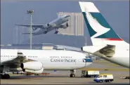  ?? PAUL HILTON / BLOOMBERG ?? Airplanes at Hong Kong Internatio­nal Airport at Chek Lap Kok. Experts say the airport’s third runway and the highspeed rail link will complement each other and strengthen Hong Kong’s position as an internatio­nal transport hub.