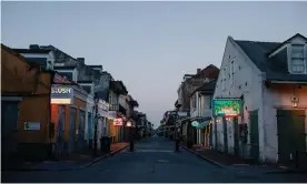  ?? Photograph: Bryan Tarnowski/The Guardian ?? Bourbon Street in the French Quarter of New Orleans is empty after state governor, John Bel Edwards, ordered a shelter in place on Monday.