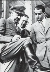  ?? AP/1937 ?? Albert Speer, right, looks over constructi­on plans with Adolf Hitler, left, and Nuremberg Lord Mayor Willy Liebel.