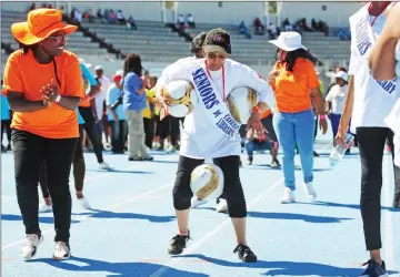  ?? Picture: Henk Kruger/African News Agency (ANA) ?? RACING TO VICTORY: Esme van Flemmering, 77, dashed to finish first in the duck walk event at the Cape Town Games for Older Persons at Green Point Athletics Stadium.