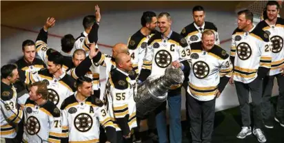  ?? JOHN TLUMACKI/GLOBE STAFF ?? The Stanley Cup was in the building as captain Zdeno Chara and the Bruins’ 2011 champions were honored on the ice before the game against the Maple Leafs.