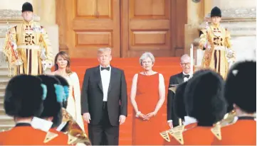  ?? — Reuters photo ?? May and her husband Philip stand together with Trump and first Lady Melania at the entrance to Blenheim Palace, where they are attending a dinner with specially invited guests and business leaders, near Oxford, Britain.