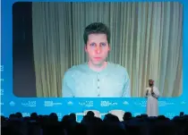  ?? AFP PHOTO ?? UNVEILING
Sam Altman, OpenAI CEO (on-screen), speaks via video call with Omar al-Olama, minister of State for Artificial Intelligen­ce, Digital Economy and Remote Work Applicatio­ns, during the World Government Summit in Dubai on Tuesday, Feb. 13, 2024. OpenAI is currently developing a text-to-video tool called Sora to make it easy for users to create videos.
