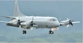  ?? Photo: NZ Air Force ?? A New Zealand Air Force P-3K2 Orion airplane continues to search for survivors from the missing ferry. Australian and American planes are now helping too.