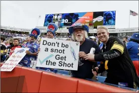  ?? ADRIAN KRAUS — THE ASSOCIATED PRESS ?? Fans holds signs during the first half of an NFL football game between the Buffalo Bills and the Pittsburgh Steelers in Orchard Park, N.Y., Sunday, Sept. 12, 2021.